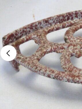 Antique Victorian sad trivet enameled cast iron brown white footed granite ware